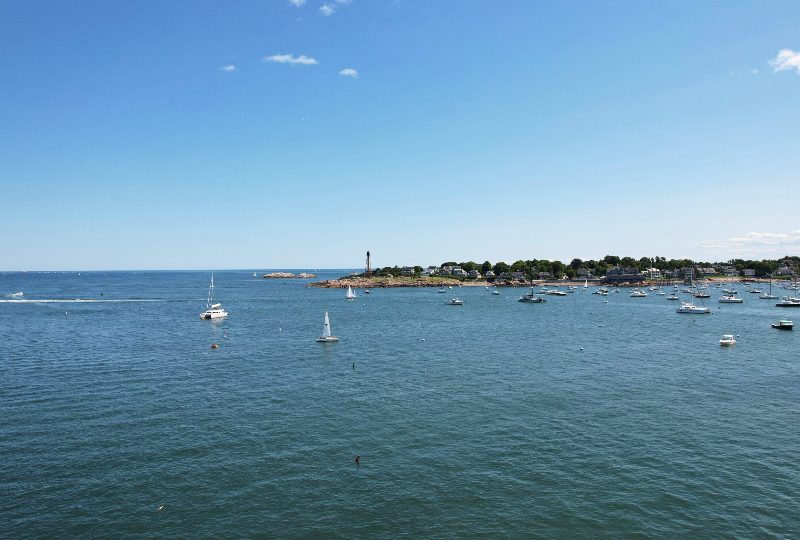 Sailing boats gliding on calm water