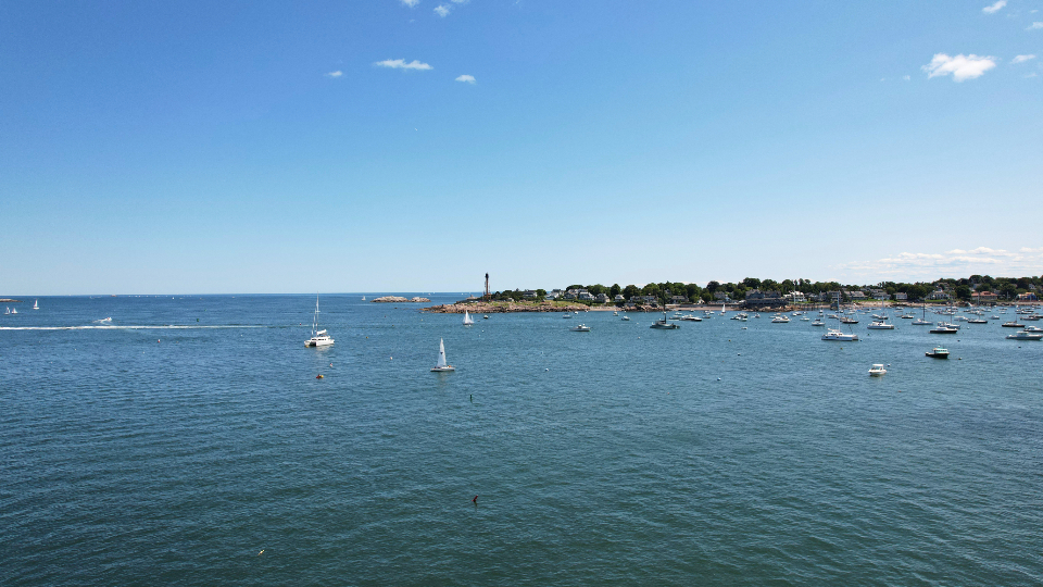 Sailing boats gliding on calm water