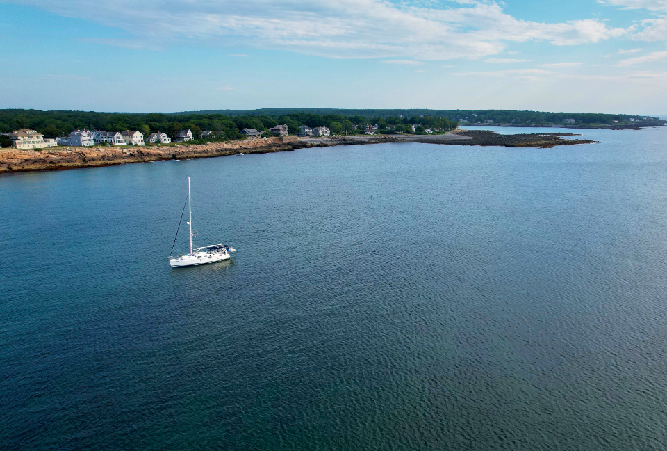 Sailing boat under full sail